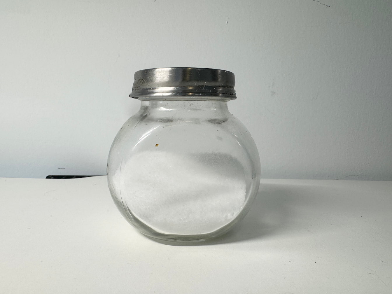 The sound of shaking salt in a container