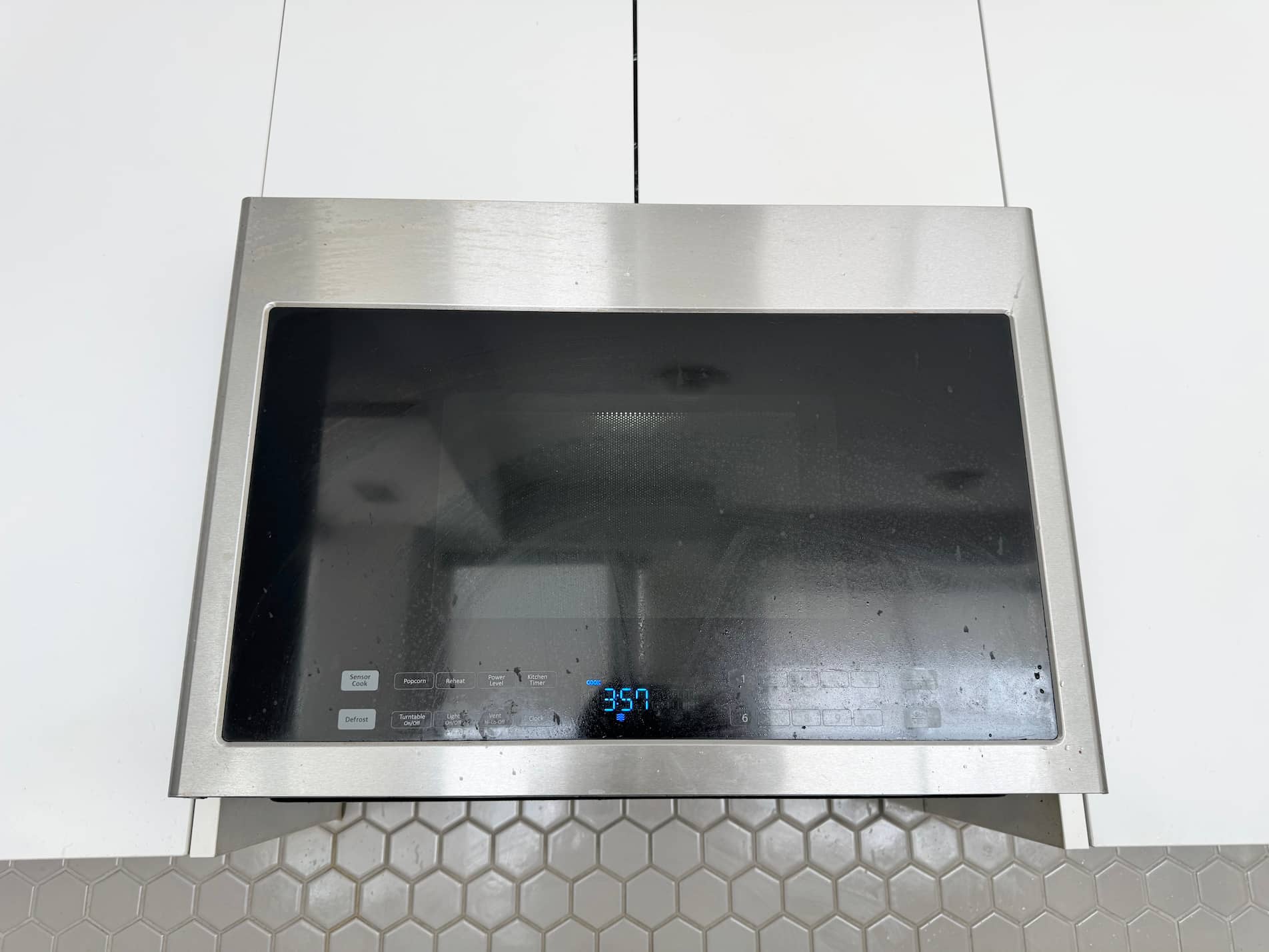 The sound of setting and starting a microwave