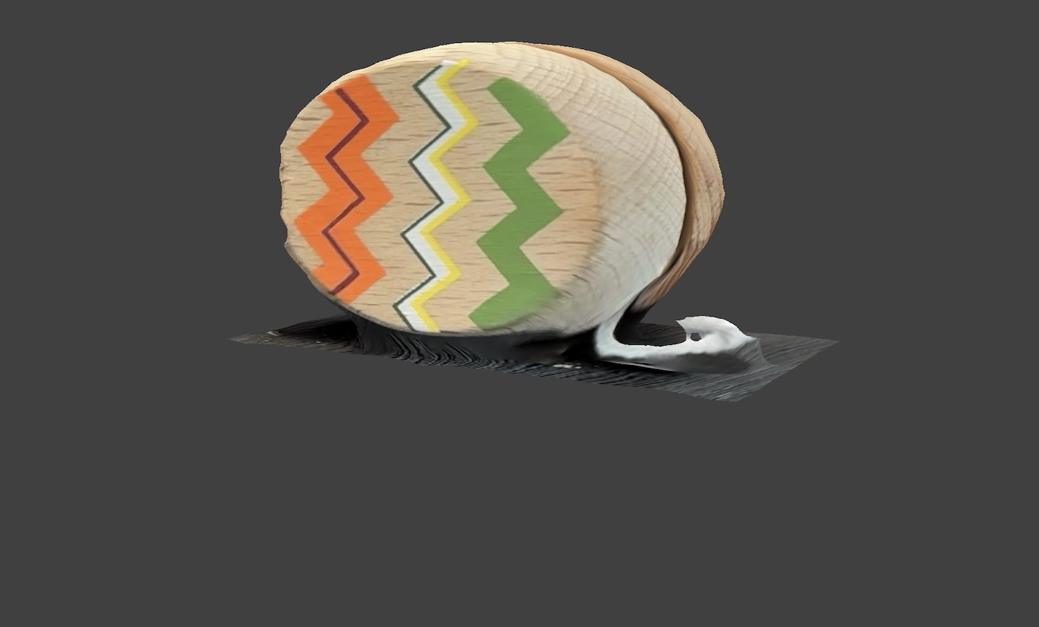 Side view of the yoyo. When I scanned it, the wooden surface came out clear. The wood grain and the painted zig-zag patterns were captured well.